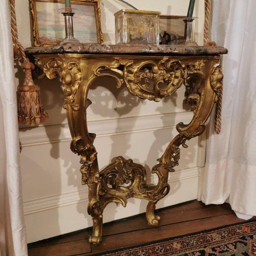 Null A gilded and stuccoed wood CONSOLE, resting on two legs linked by a brace d&hellip;