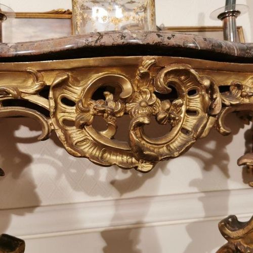 Null A gilded and stuccoed wood CONSOLE, resting on two legs linked by a brace d&hellip;