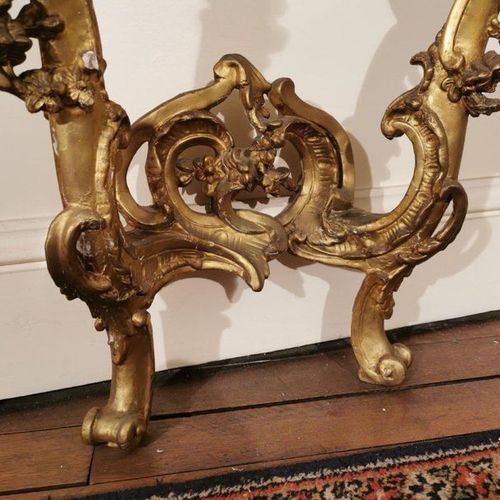 Null A gilded and stuccoed wood CONSOLE, resting on two legs linked by a brace d&hellip;
