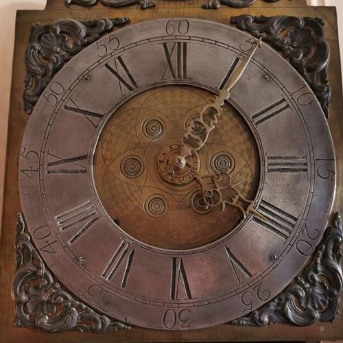 Null CLOCK. The case in natural wood opening by a door. The dial indicating the &hellip;