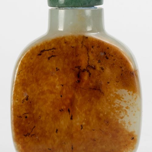 Null A pale and rust jade snuff bottle, China, Qing dynasty, one side flattened &hellip;