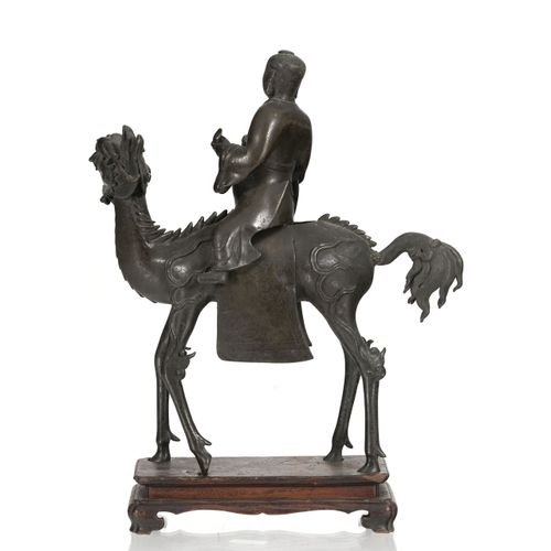 Null A bronze sculpture of a figure on a qilin, China, Qing dynasty, 38,5 cm hig&hellip;