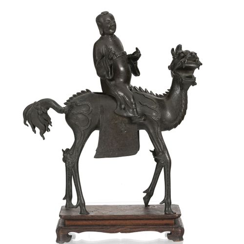 Null A bronze sculpture of a figure on a qilin, China, Qing dynasty, 38,5 cm hig&hellip;