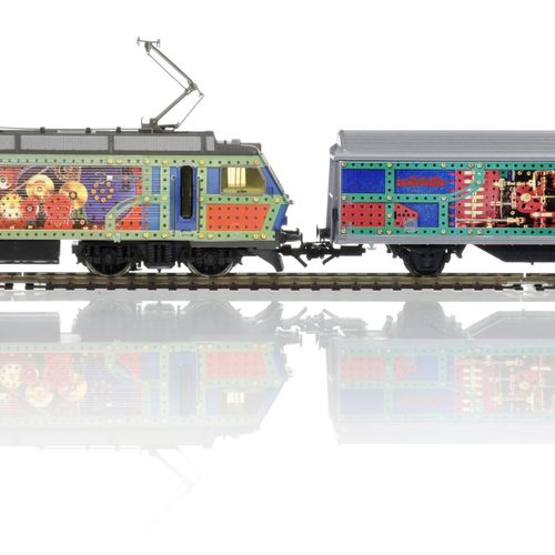 Null Märklin（德国），HO比例，Märklin饰面，一套1台Re 446（DC）机车和7辆货运车。所有的艺术植绒

如同新的一样，装在原来的盒子里
&hellip;