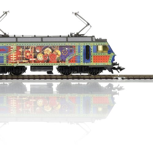 Null Märklin（德国），HO比例，Märklin饰面，一套1台Re 446（DC）机车和7辆货运车。所有的艺术植绒

如同新的一样，装在原来的盒子里
&hellip;