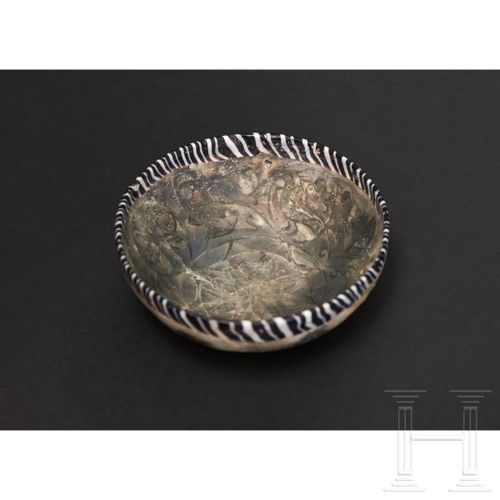 Null A late Hellenistic/early Roman glass bowl with floral décor in pigment coat&hellip;