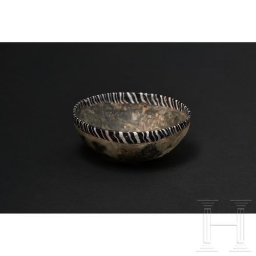 Null A late Hellenistic/early Roman glass bowl with floral décor in pigment coat&hellip;