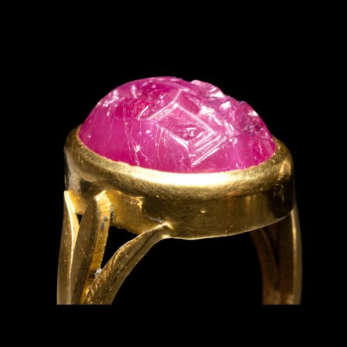 Null RING
gold, set with a cabochon intaglio on ruby depicting an erotic scene. &hellip;