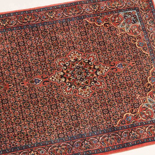 BIDJAR W Persia, c. 1990. Extra-fine woven carpet. The midnight blue field is de&hellip;
