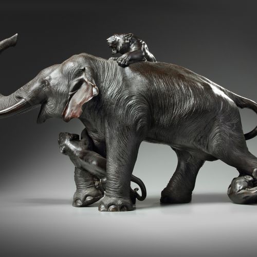 A LARGE JAPANESE BRONZE ELEPHANT AND TIGER GROUP, MEIJI PERIOD (1868-1912) The e&hellip;