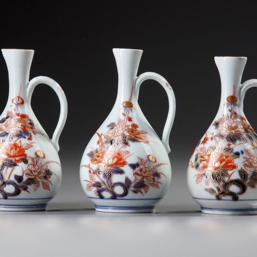 THREE JAPANESE IMARI EWERS, 17TH CENTURY All decorated in iron-red and gilt on u&hellip;