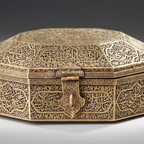 A QAJAR OPENWORK OCTAGONAL BRASS BOX WITH COVER, 19TH CENTURY A large brass box &hellip;