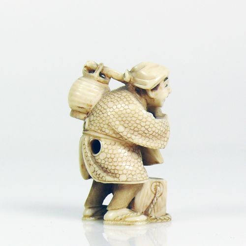 Null Netsuke (Japan, c. 1900) standing man with water vessel on his back; ivory;&hellip;