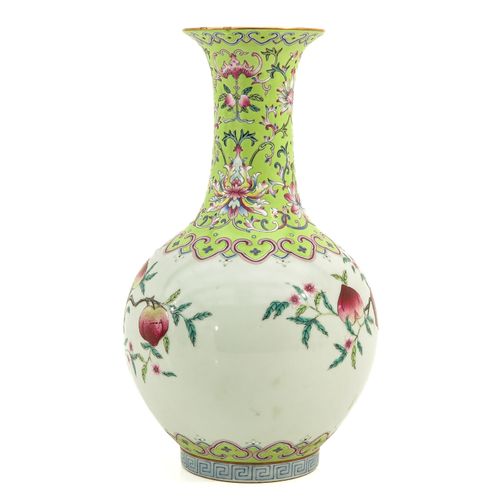 Null A Famille Rose Vase
9 peach decor, Qianlong mark, 32 cm. Tall.