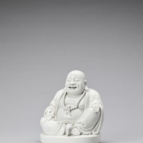 A WHITE GLAZED DEHUA PORCELAIN FIGURE OF BUDAI, QING A WHITE GLAZED DEHUA PORCEL&hellip;