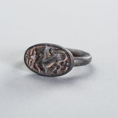 A BRONZE INTAGLIO RING DEPICTING A MYTHICAL BEAST A BRONZE INTAGLIO RING DEPICTI&hellip;