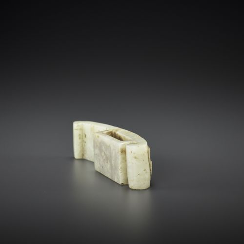 AN ARCHASITIC JADE SCABBARD SLIDE WITH DRAGON AMID CLOUDS, EARLY MING AN ARCHASI&hellip;