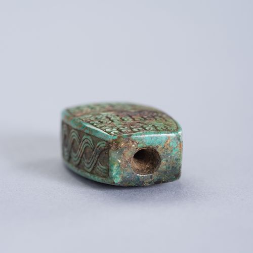 A TURQUOISE PENDANT OF AN ARCHAISTIC BEAD PENDANT DE TURQUOISE EN PERLE ARCHATIQ&hellip;