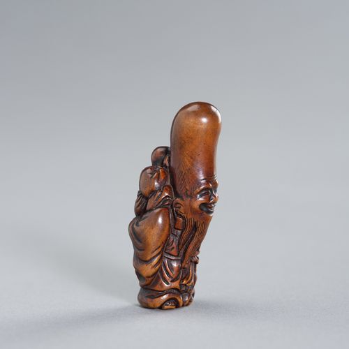 A WOOD NETSUKE OF FUKUROKUJU AND KARAKO A WOOD NETSUKE OF FUKUROKUJU AND KARAKOJ&hellip;