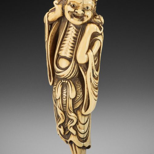 A TALL AND MASSIVE IVORY NETSUKE OF GAMA SENNIN UN TALL AND MASSIVE IVORY NETSUK&hellip;