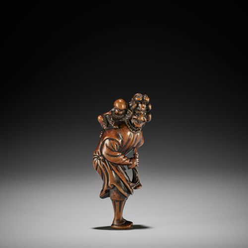 A GOOD WOOD NETSUKE OF A DUTCHMAN DUTCHMAN的木制网罩
无署名
日本，18世纪，江户时代（1615-1868）

典型的&hellip;