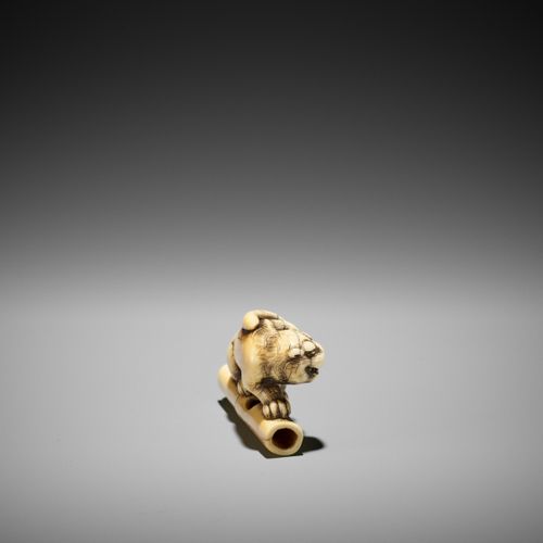 A POWERFUL KYOTO SCHOOL IVORY NETSUKE OF A TIGER ON BAMBOO UN PUISSANT NETSUKE E&hellip;