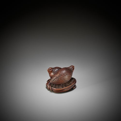 OKATOMO: A RARE STAINED WOOD NETSUKE OF TWO QUAILS ON MILLET 冈友：罕见的青花木网书：两只鹌鹑在小米&hellip;