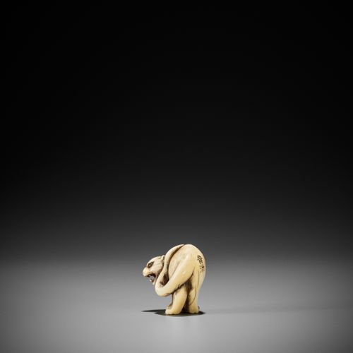 OTOMAN: A SUPERB IVORY NETSUKE OF A TIGER OTOMAN: A SUPERB IVORY NETSUKE OF A TI&hellip;