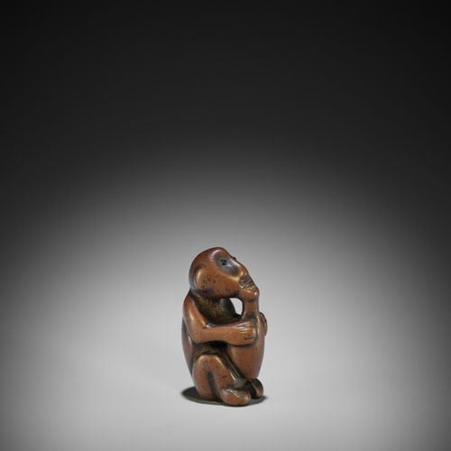 A RARE AND UNUSUAL NETSUKE OF AN ISLANDER DRINKING FROM A BOTTLE A RARE AND UNUS&hellip;