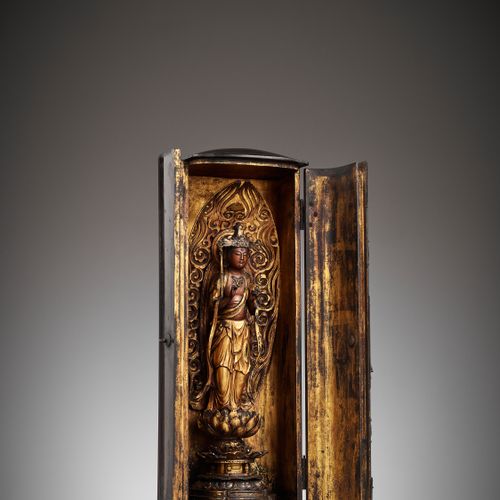 A LACQUER ZUSHI (PORTABLE BUDDHIST SHRINE) DEPICTING KANNON WITH A RETICULATED A&hellip;