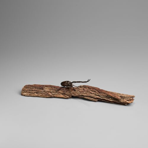 AN ARTICULATED BRONZE OKIMONO OF A SAWYER BEETLE CLIMBING A ROOTWOOD LOG OKIMONO&hellip;