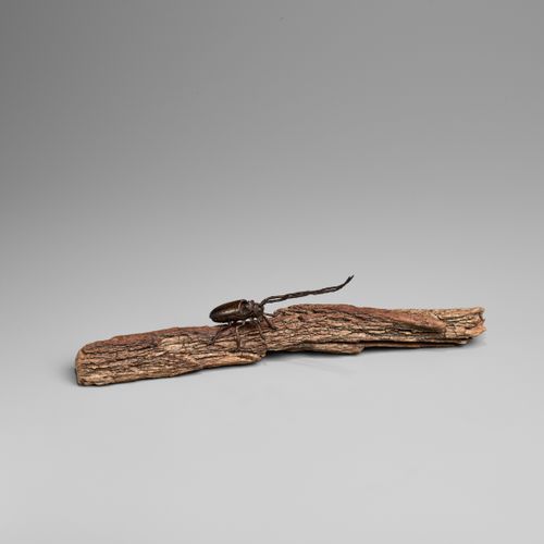 AN ARTICULATED BRONZE OKIMONO OF A SAWYER BEETLE CLIMBING A ROOTWOOD LOG OKIMONO&hellip;