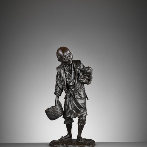 TAKAMITSU: A VERY FINE AND LARGE TOKYO SCHOOL BRONZE OKIMONO OF A MAN GATHERING &hellip;