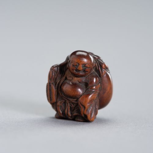 A RARE MINIATURE WOOD NETSUKE OF HOTEI A RARE MINIATURE WOOD NETSUKE OF HOTEI
Ja&hellip;