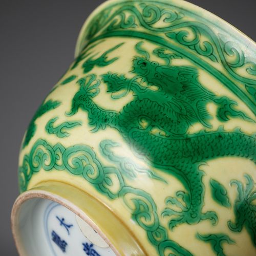 A YELLOW-GROUND GREEN-ENAMELED 'DRAGON' BOWL, KANGXI MARK AND PERIOD A YELLOW-GR&hellip;