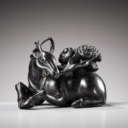 A ZITAN FIGURE OF A DEER HOLDING LINGZHI, 18TH CENTURY ZITAN鹿抱灵芝像，18世纪
中国。雕工精湛，后&hellip;