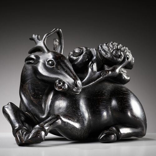 A ZITAN FIGURE OF A DEER HOLDING LINGZHI, 18TH CENTURY A ZITAN FIGURE OF A DEER &hellip;