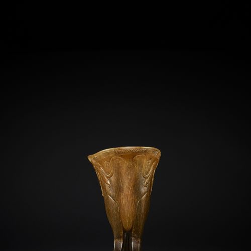 A RHINOCEROS HORN ARCHAISTIC LIBATION CUP, JUE, EARLY QING DYNASTY COUPE DE LIBE&hellip;