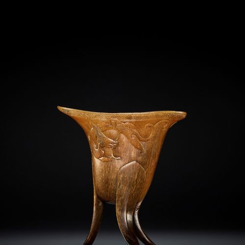 A RHINOCEROS HORN ARCHAISTIC LIBATION CUP, JUE, EARLY QING DYNASTY COPA DE LIBER&hellip;