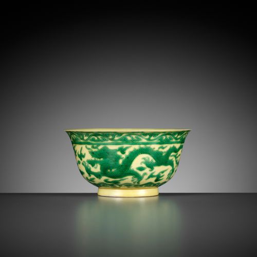 A YELLOW-GROUND GREEN-ENAMELED 'DRAGON' BOWL, KANGXI MARK AND PERIOD UNA BOCCA "&hellip;