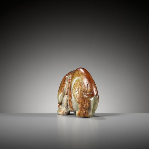 A CELADON AND RUSSET JADE FIGURE OF AN ELEPHANT, MING DYNASTY A CELADON AND RUSS&hellip;