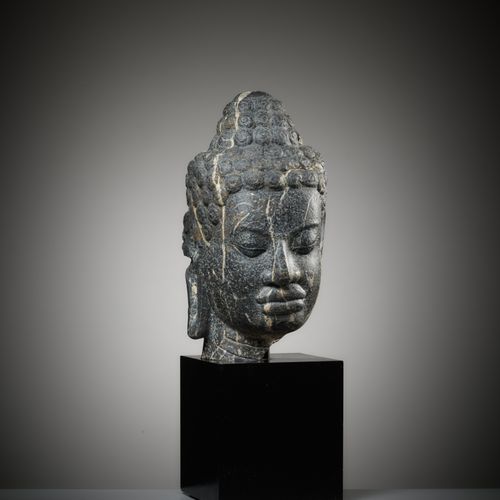 A MONUMENTAL STONE HEAD OF BUDDHA, MON-DVARAVATI PERIOD A MONUMENTAL STONE HEAD &hellip;