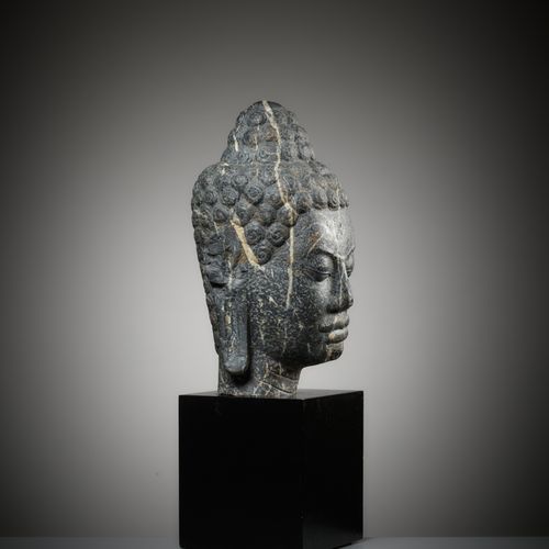 A MONUMENTAL STONE HEAD OF BUDDHA, MON-DVARAVATI PERIOD A MONUMENTAL STONE HEAD &hellip;