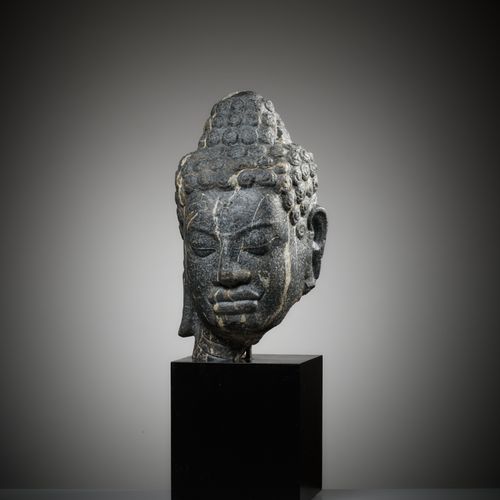 A MONUMENTAL STONE HEAD OF BUDDHA, MON-DVARAVATI PERIOD A MONUMENTAL STONE HEAD &hellip;