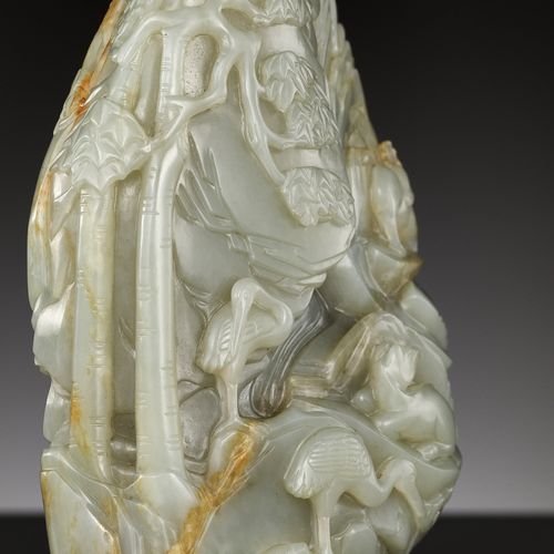 A CELADON AND RUSSET JADE 'DEER AND CRANE' BOULDER, 18TH CENTURY A CELADON AND R&hellip;