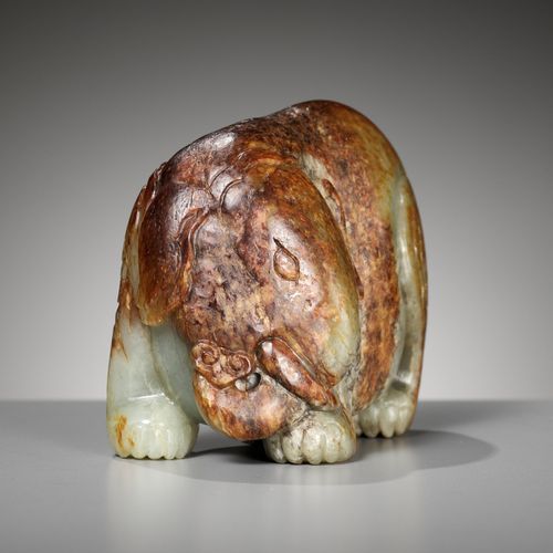 A CELADON AND RUSSET JADE FIGURE OF AN ELEPHANT, MING DYNASTY A CELADON AND RUSS&hellip;