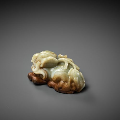 A CELADON AND RUSSET JADE 'BUDDHIST LION AND CUB' GROUP, 17TH CENTURY A CELADON &hellip;