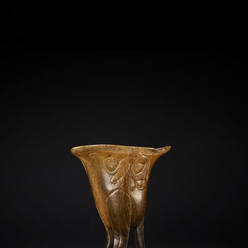 A RHINOCEROS HORN ARCHAISTIC LIBATION CUP, JUE, EARLY QING DYNASTY COUPE DE LIBE&hellip;