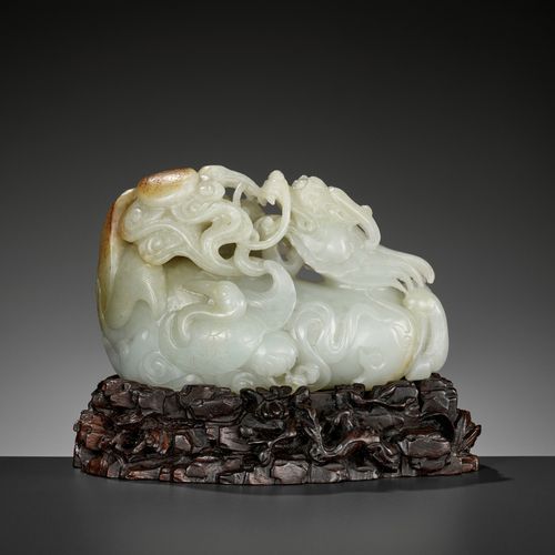 A CELADON AND RUSSET JADE 'QILIN AND CRANES' GROUP, 18TH CENTURY A CELADON AND R&hellip;