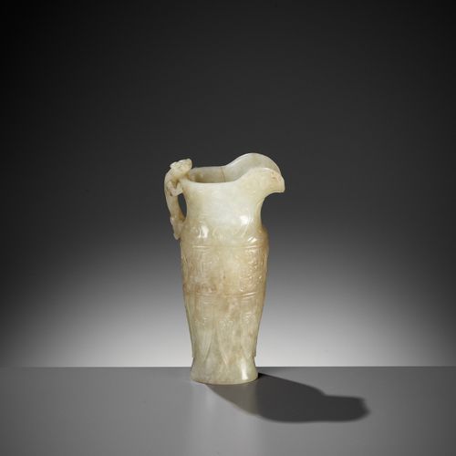 AN IMPERIAL CELADON AND RUSSET JADE 'CHILONG' RHYTON, QIANLONG MARK AND PERIOD R&hellip;
